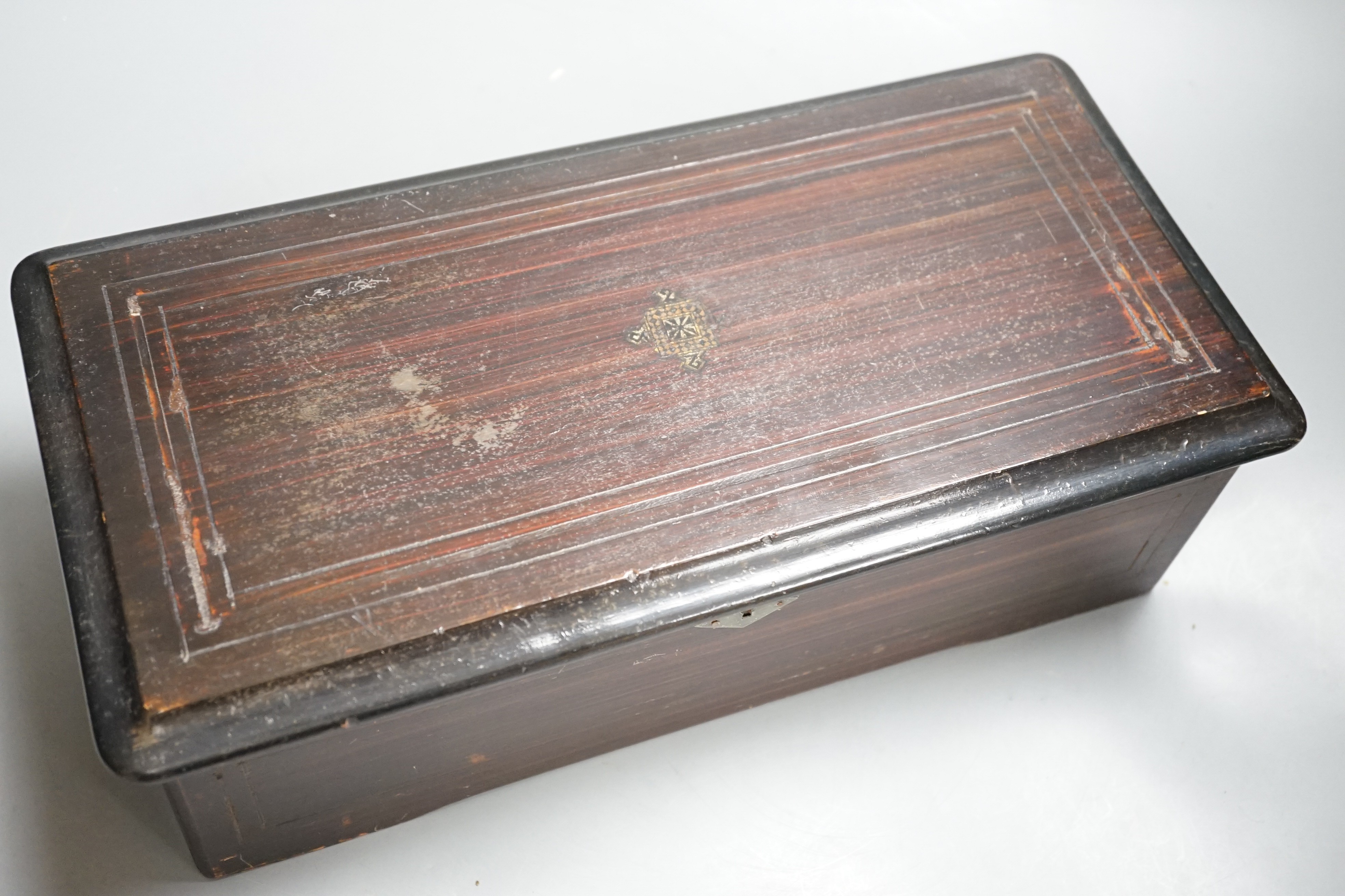 A late 19th century Swiss musical box. Case 37cm long, cylinder 15.5cm long